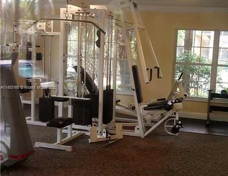 4055 West McNab Road, Unit H303 Pompano Beach, FL 33069 - Photo 19 of 29 a view of a room with gym equipment