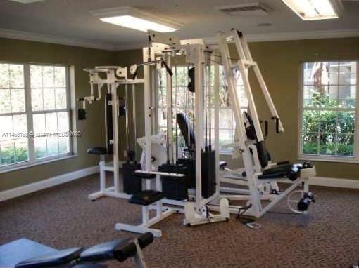 4055 West McNab Road, Unit H303 Pompano Beach, FL 33069 - Photo 21 of 29 a view of a room with gym equipment