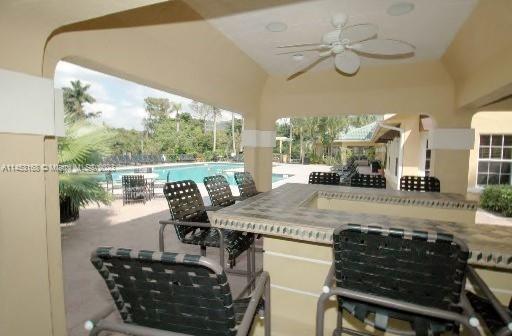 4055 West McNab Road, Unit H303 Pompano Beach, FL 33069 - Photo 26 of 29 a view of a dining room with furniture window and outside view
