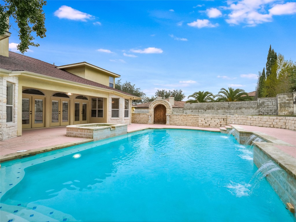 1014 Challenger Lakeway, TX 78734 - Photo 2 of 16 a view of house with yard and ocean view