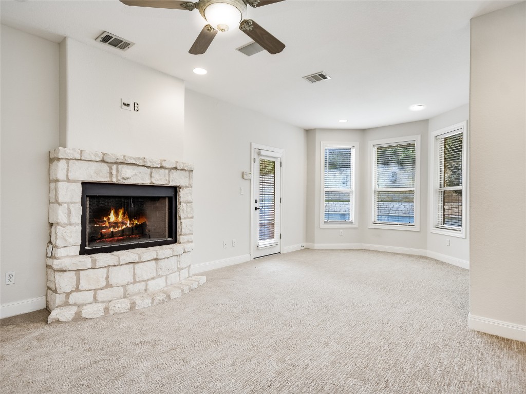 1014 Challenger Lakeway, TX 78734 - Photo 10 of 16 a view of an empty room with a fireplace
