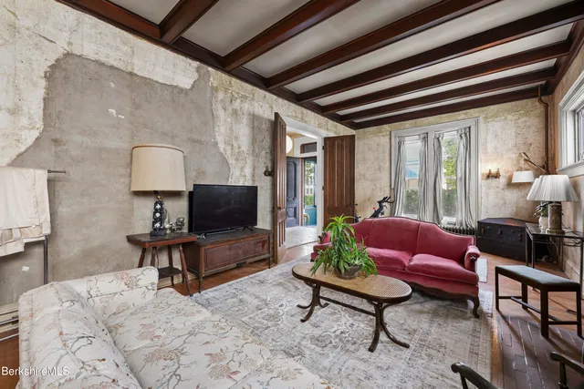 a living room with furniture and a flat screen tv