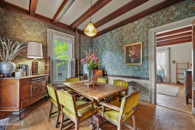 a dining room with furniture and window