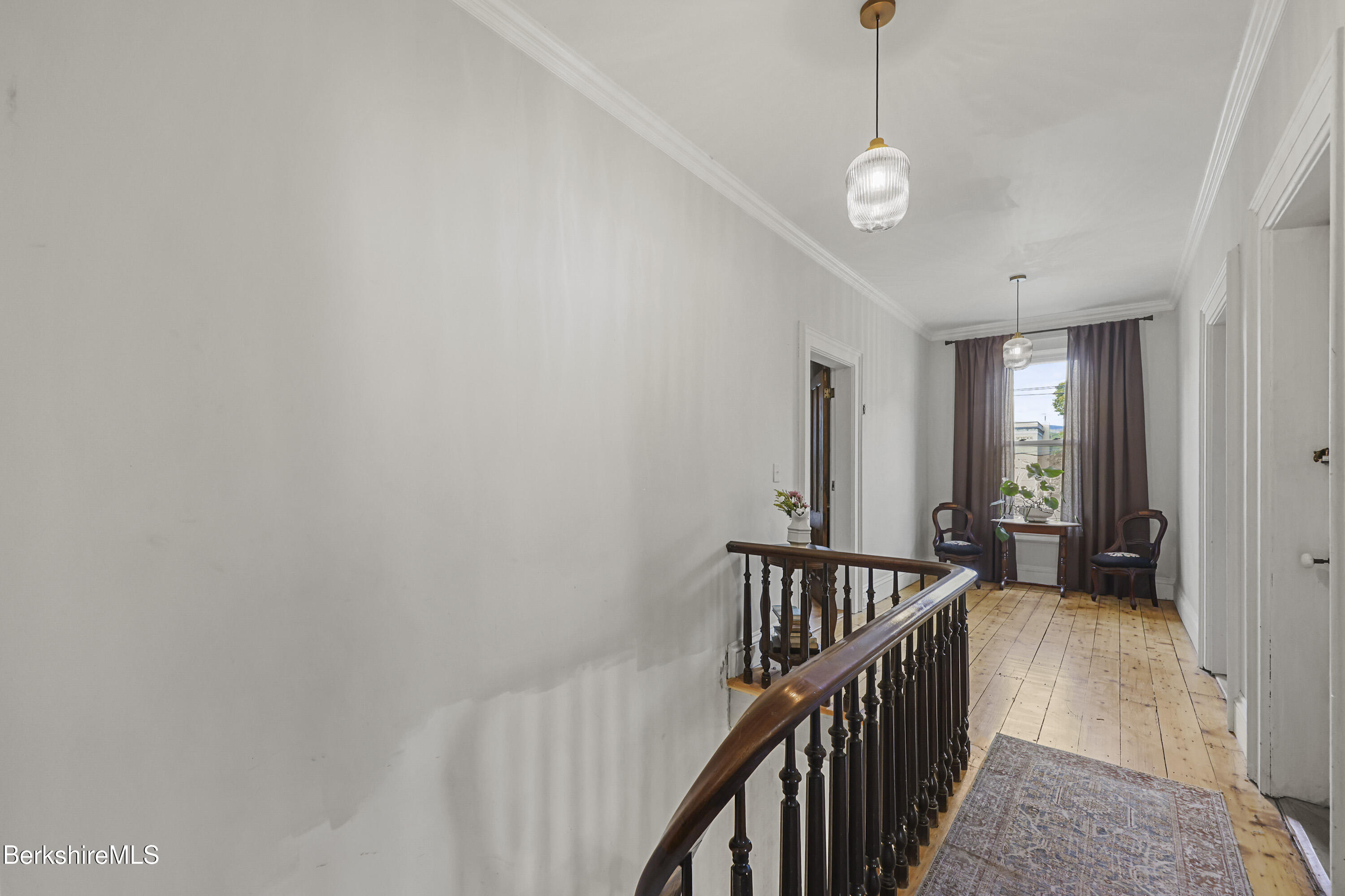 194 East Main Street North Adams, MA 01247 - Photo 21 of 50 a view of a hallway with wooden floor and stairs