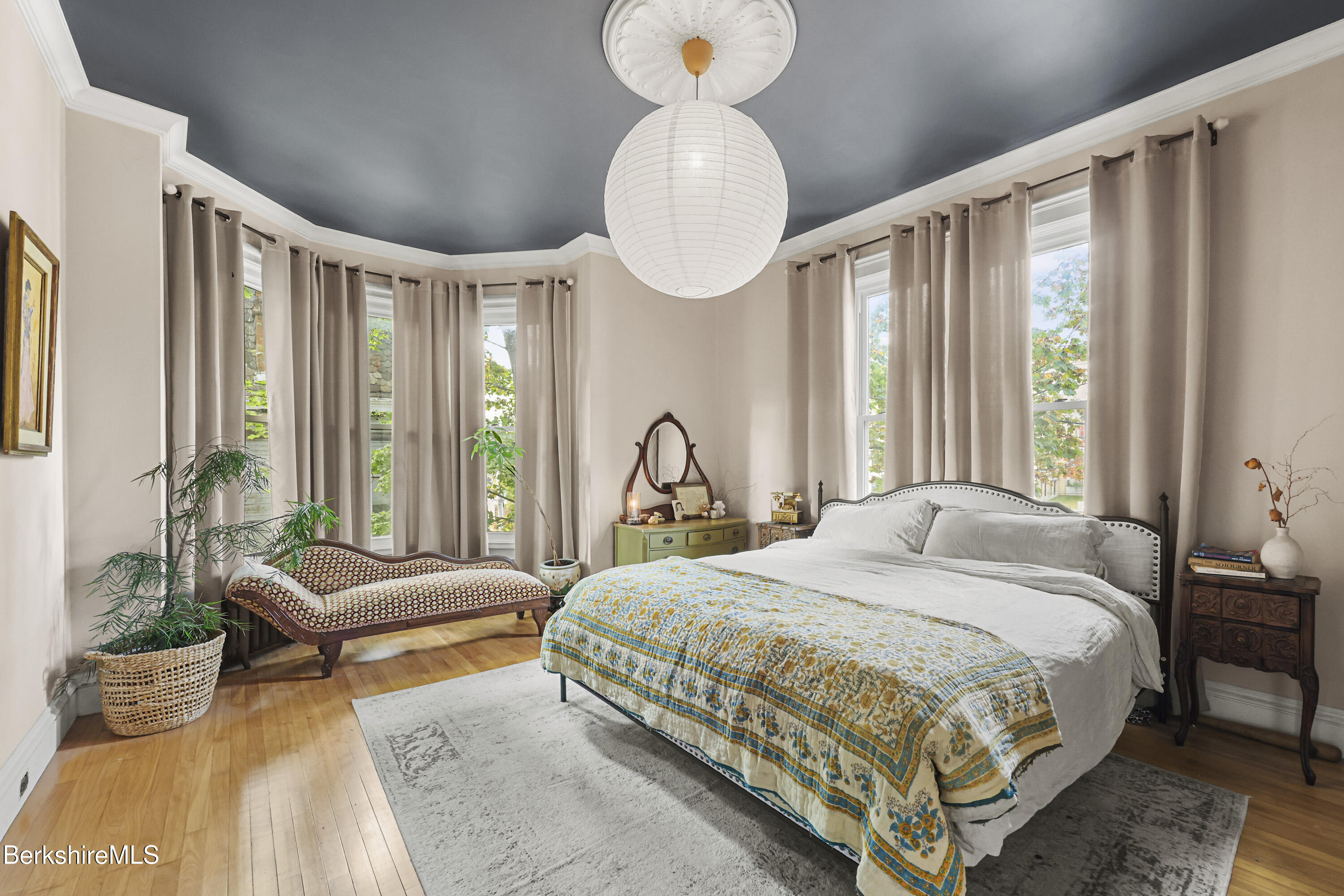 194 East Main Street North Adams, MA 01247 - Photo 25 of 50 a bedroom with a bed and a chandelier