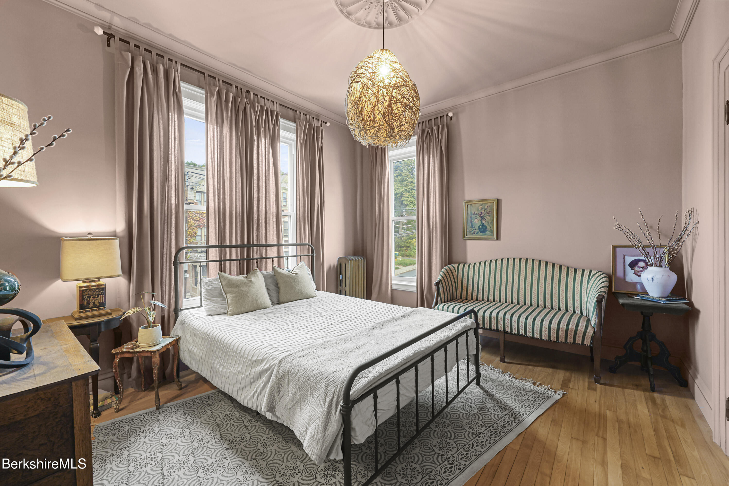 194 East Main Street North Adams, MA 01247 - Photo 27 of 50 a bedroom with a bed and a chandelier