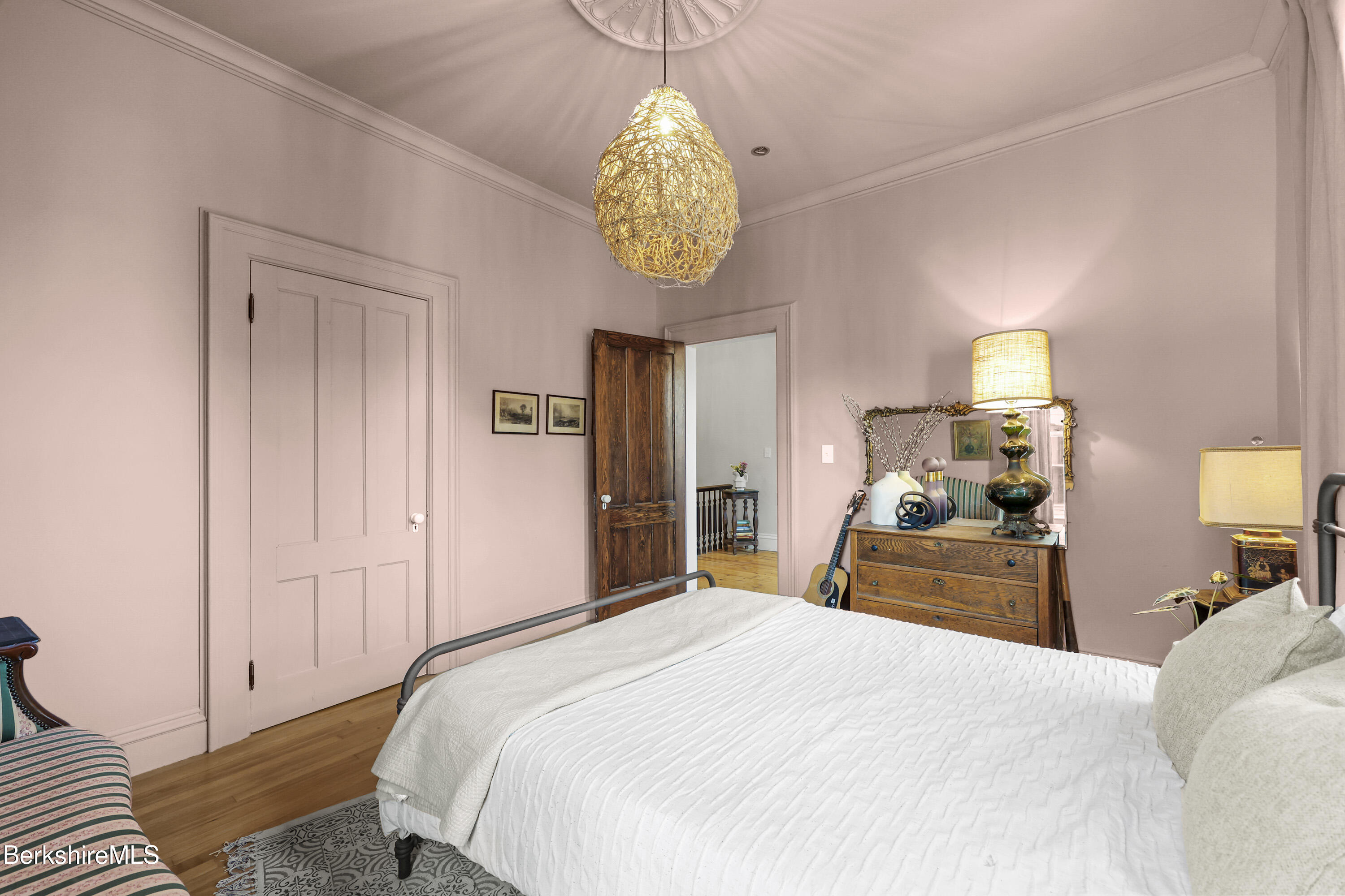 194 East Main Street North Adams, MA 01247 - Photo 28 of 50 a bedroom with a bed and a chandelier