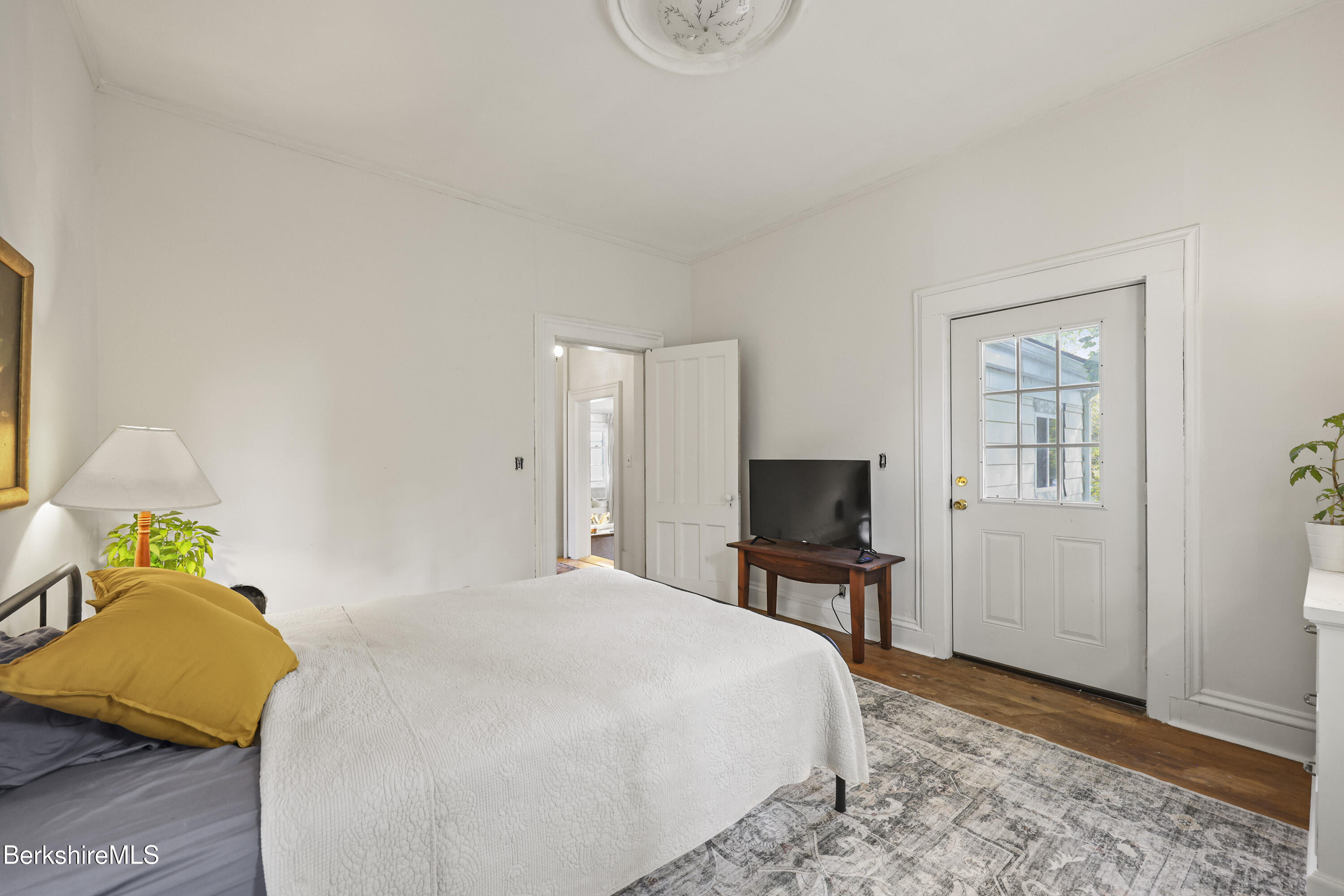 194 East Main Street North Adams, MA 01247 - Photo 30 of 50 a bedroom with a bed and wooden floor