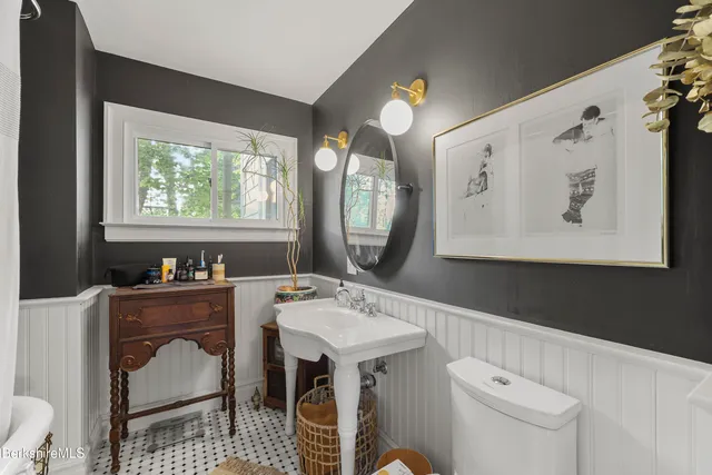 a view of a dining room with furniture and a window