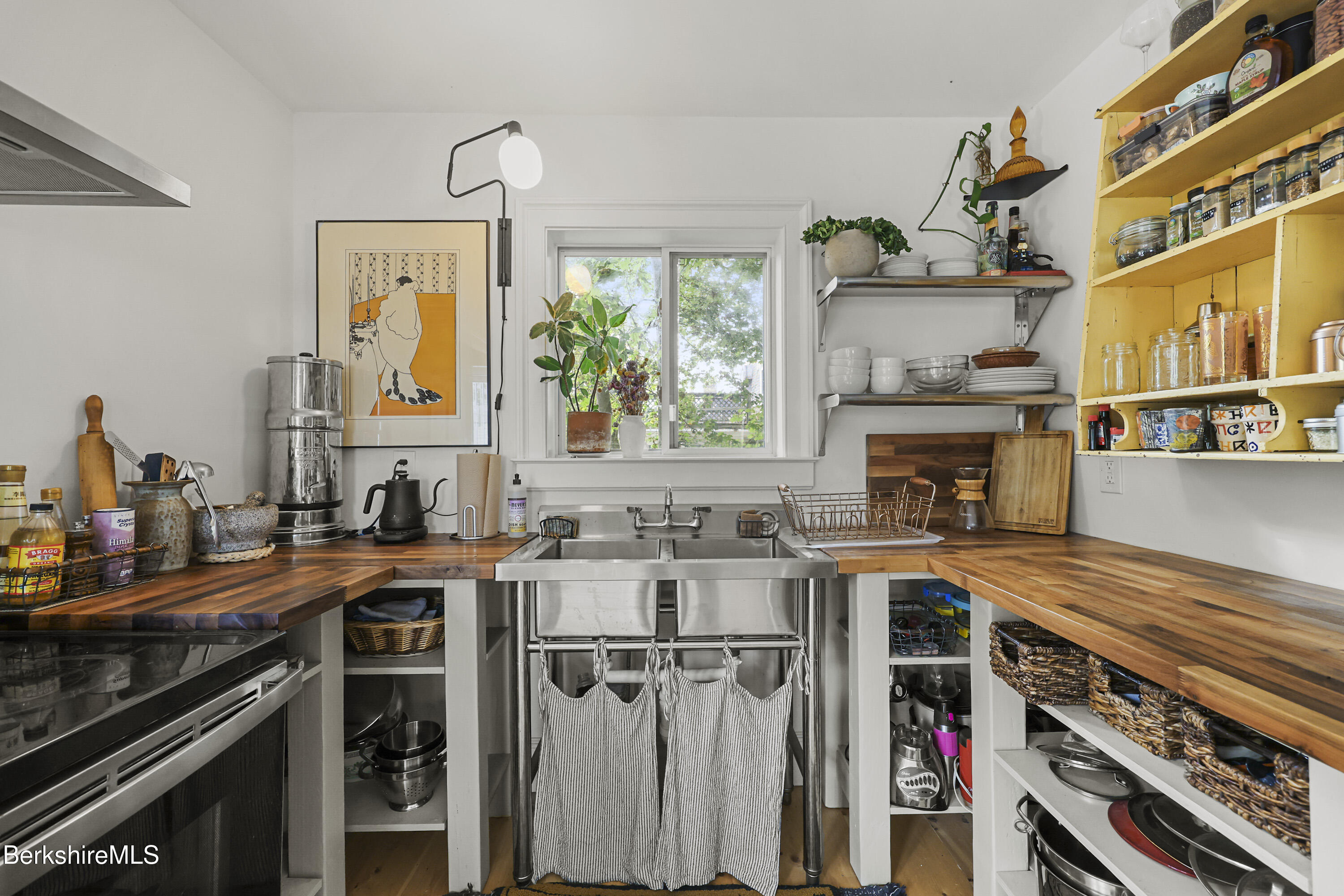 194 East Main Street North Adams, MA 01247 - Photo 39 of 50 a kitchen with stainless steel appliances a stove a sink and a refrigerator