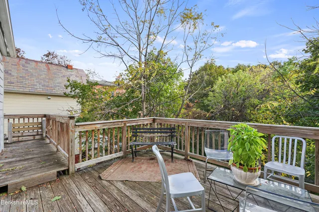 a view of a chair and table on the wooden floor