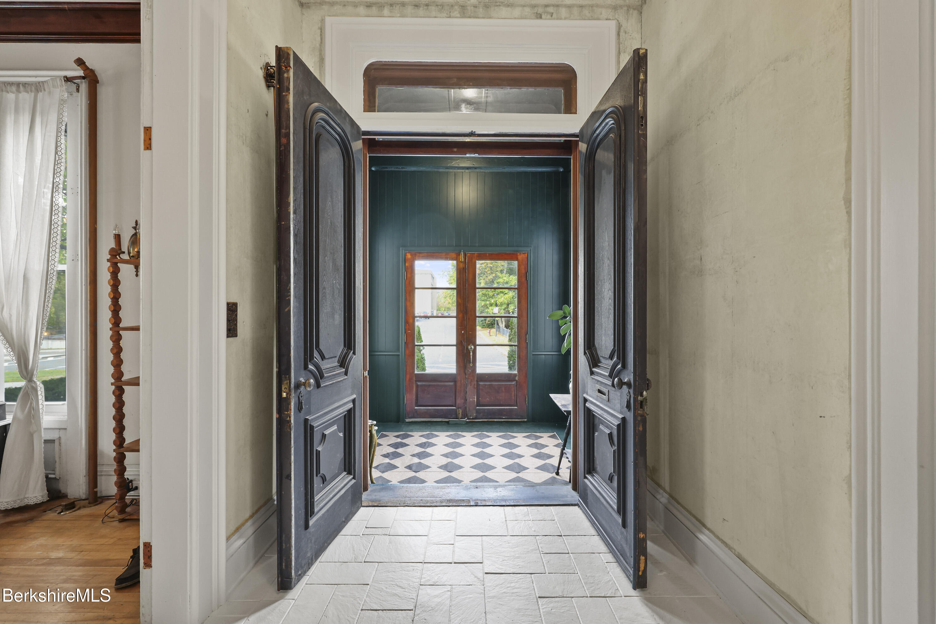 194 East Main Street North Adams, MA 01247 - Photo 5 of 50 a hallway with a door and a mirror