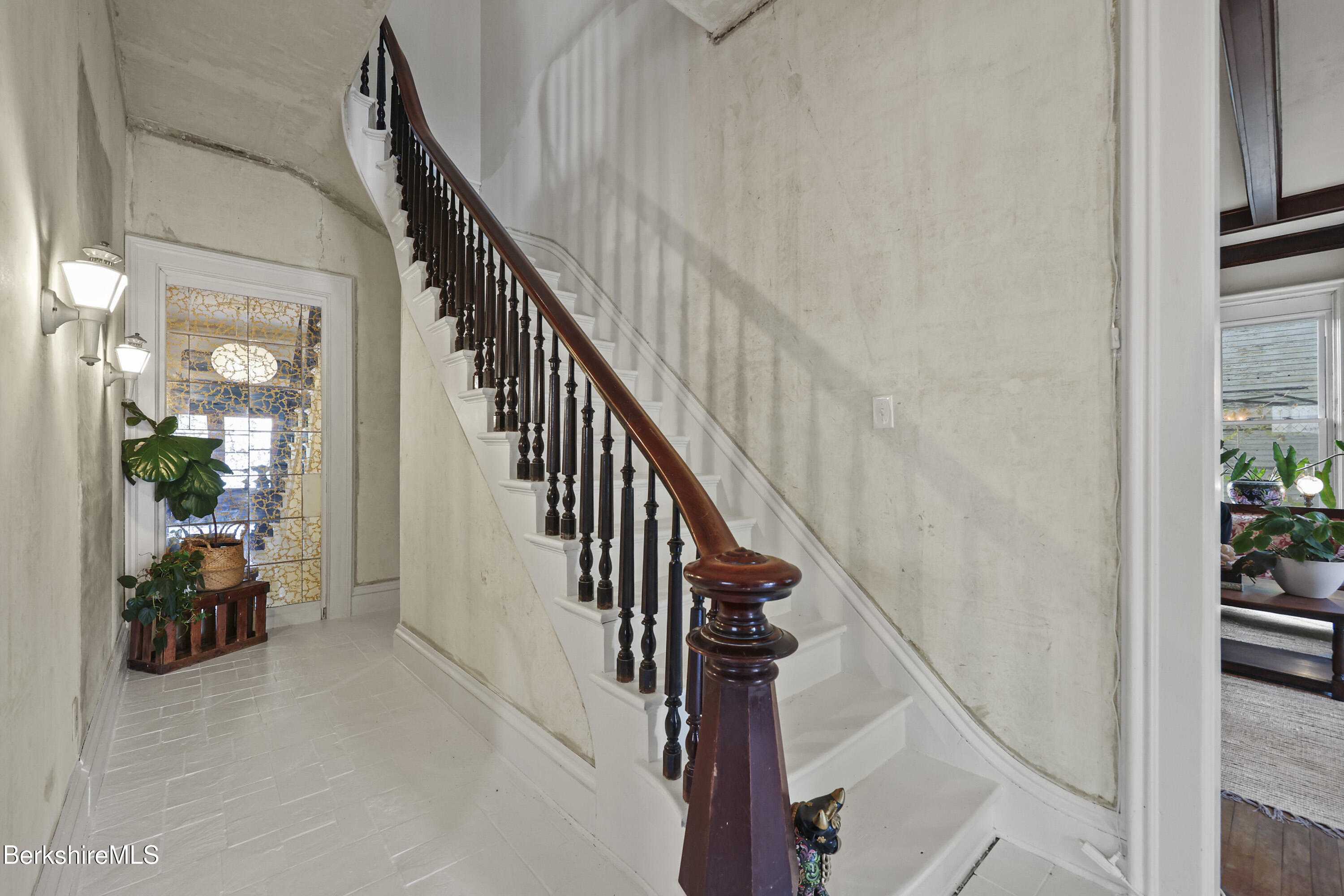 194 East Main Street North Adams, MA 01247 - Photo 7 of 50 a view of staircase with lots of frames on wall and windows