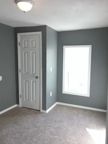 an empty room that has a window