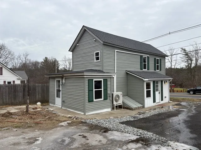 a front view of a house with a garage