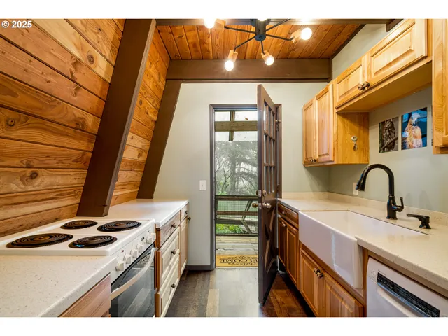 a kitchen that has a sink and a stove