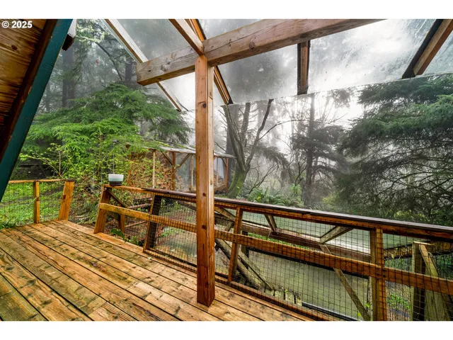 a view of balcony with wooden floor