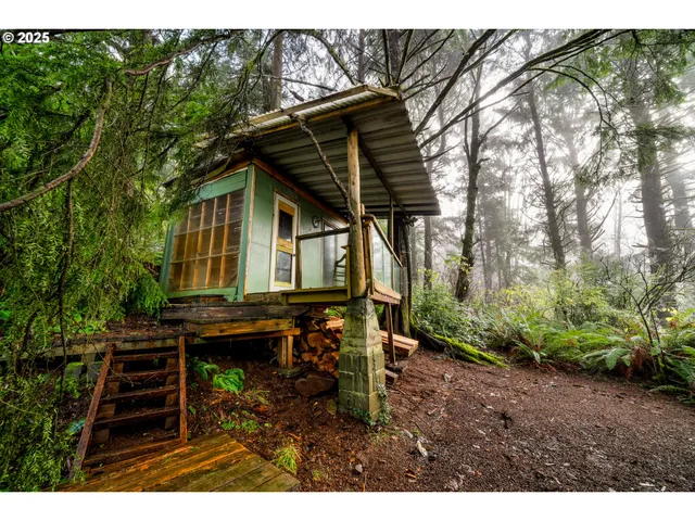 a backyard of a house with barbeque oven table and chairs