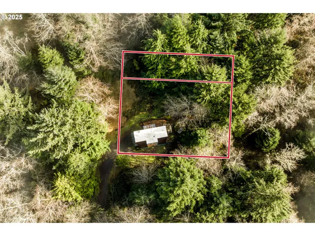 a aerial view of a house with a yard