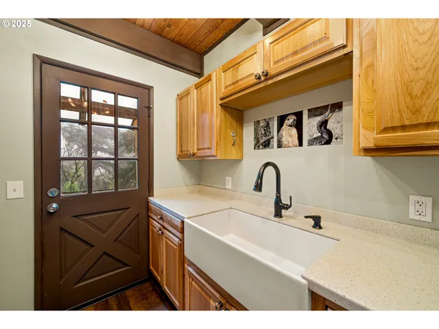 a kitchen with a sink and a window