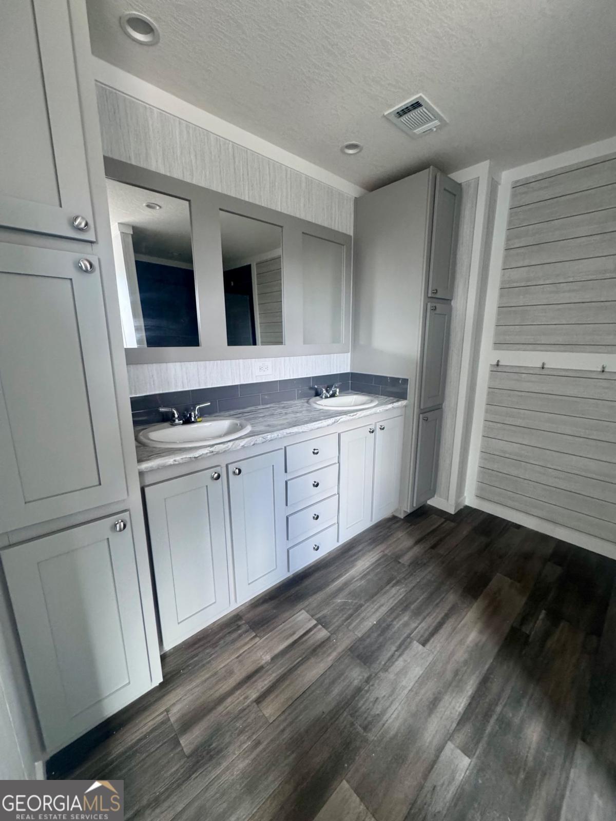 59 Long Leaf Road Hazlehurst, GA 31539 - Photo 12 of 19 a kitchen with a sink and cabinets
