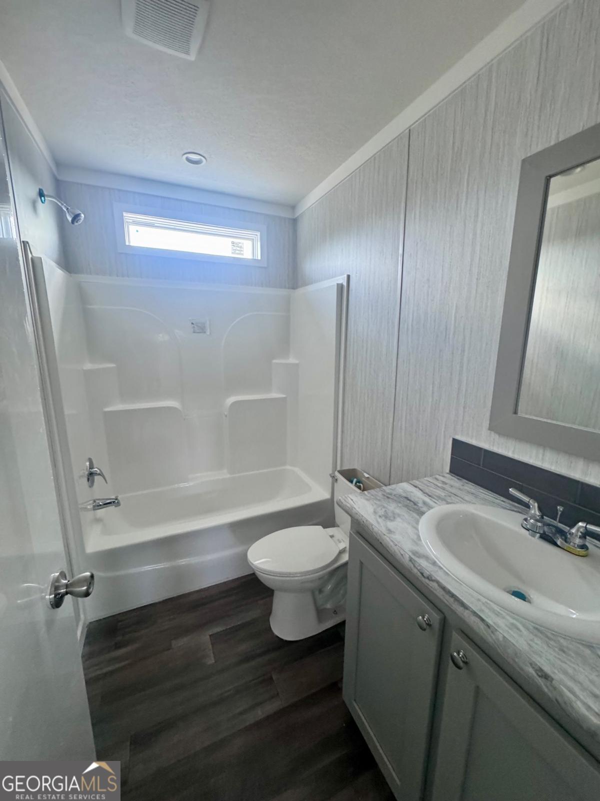 59 Long Leaf Road Hazlehurst, GA 31539 - Photo 17 of 19 a bathroom with a sink a toilet and shower