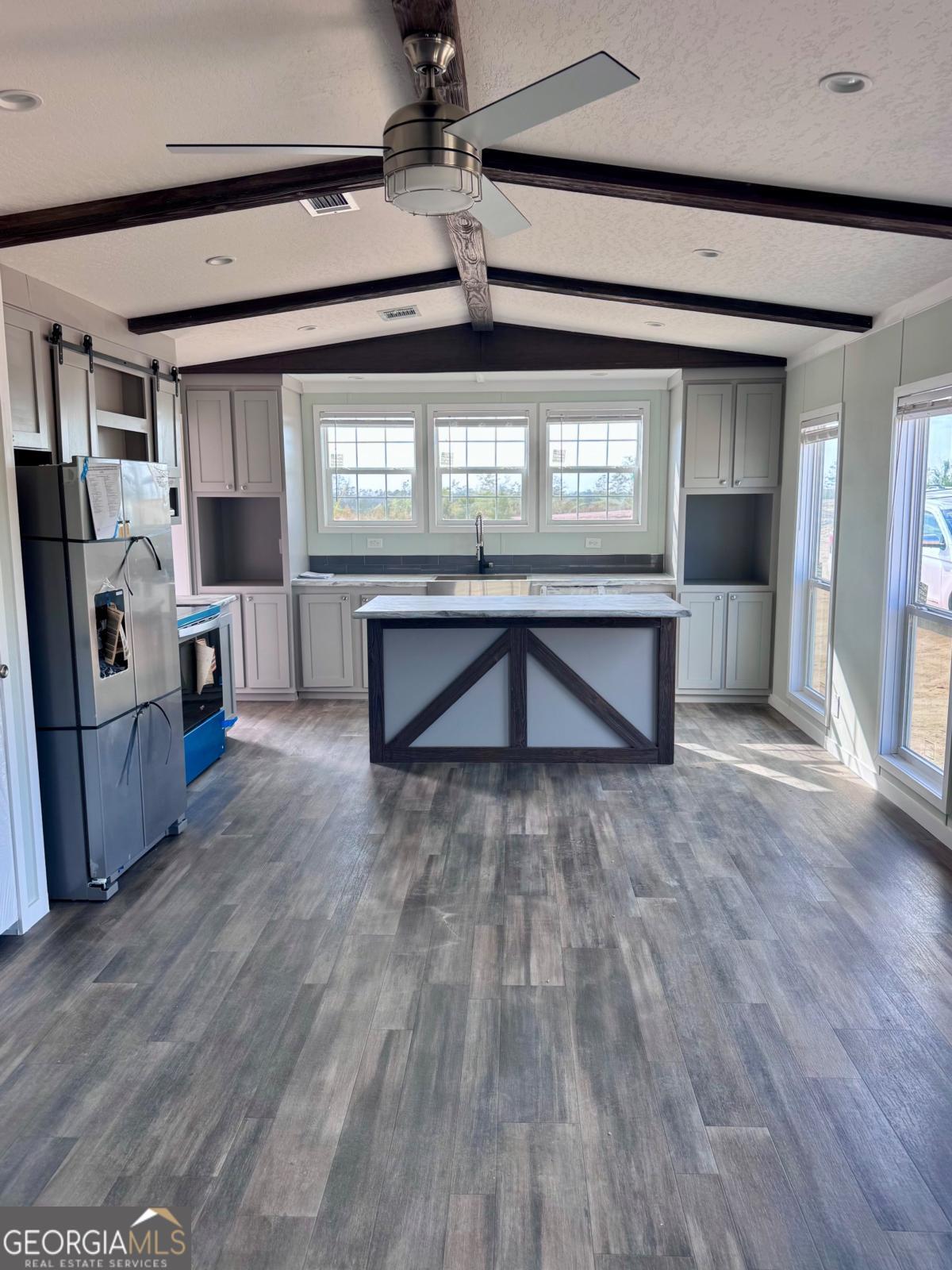59 Long Leaf Road Hazlehurst, GA 31539 - Photo 5 of 19 a living room with stainless steel appliances granite countertop furniture wooden floor and a window
