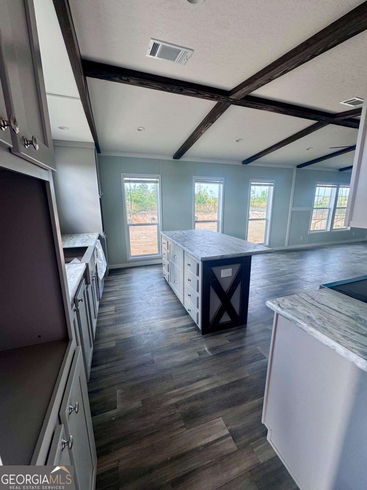 59 Long Leaf Road Hazlehurst, GA 31539 - Photo 9 of 19 a view of an entryway with wooden floor