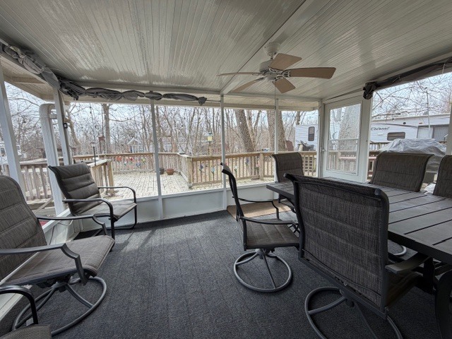 2795 East 28th Road Marseilles, IL 61341 - Photo 23 of 69 a living room with furniture a flat screen tv and a floor to ceiling window