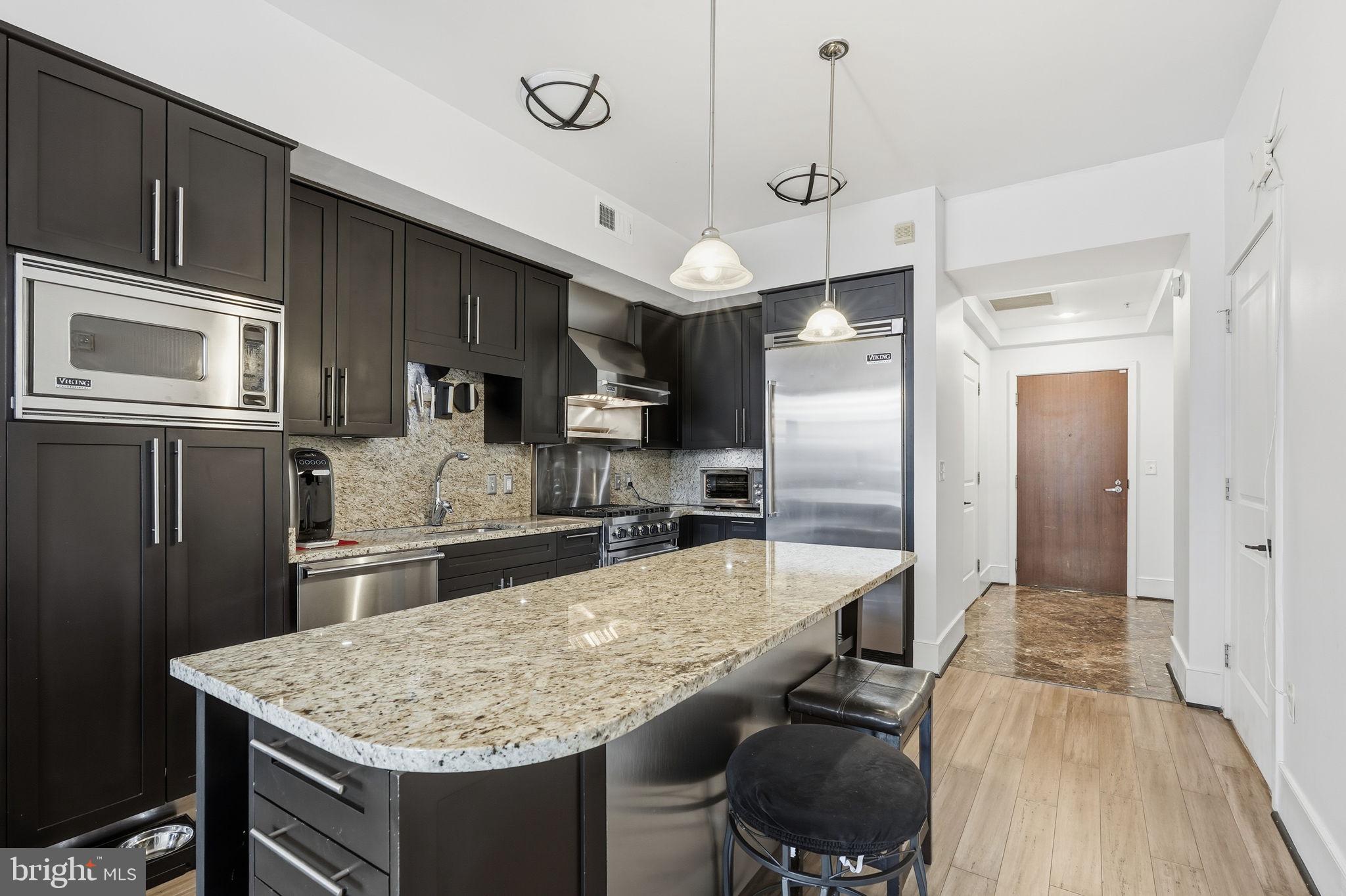 4301 Military Road Northwest, Unit 306 Washington, DC 20015 - Photo 4 of 22 Kitchen/center island