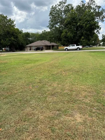 a view of a swimming pool with an outdoor space and seating area