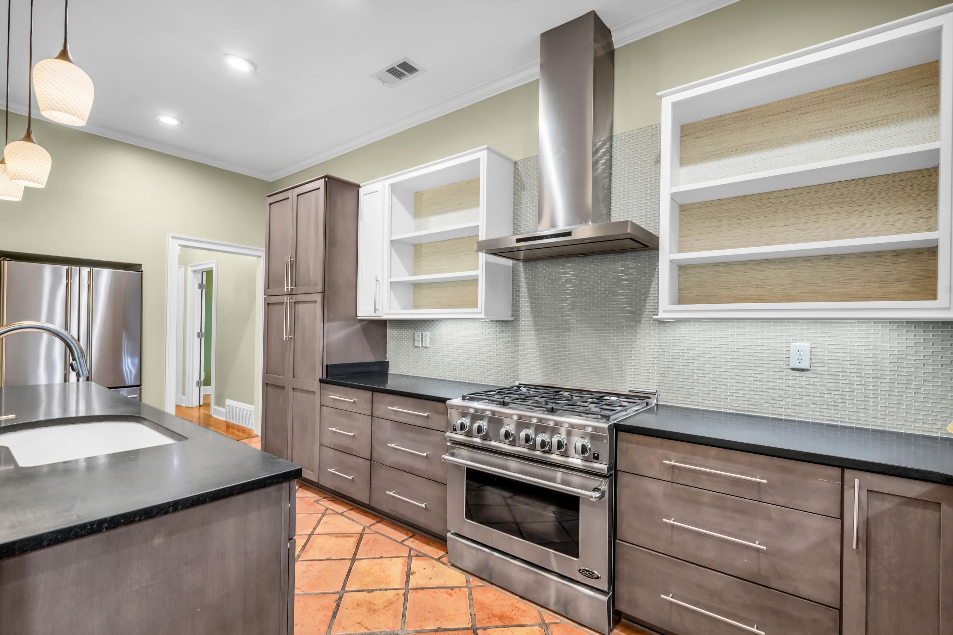 99 Red Acres Place Memphis, TN 38111 - Photo 12 of 39 a kitchen with stainless steel appliances granite countertop a sink stove and refrigerator