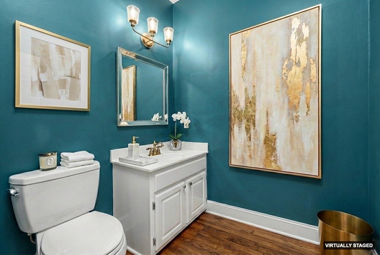 99 Red Acres Place Memphis, TN 38111 - Photo 13 of 39 a bathroom with a toilet sink and mirror