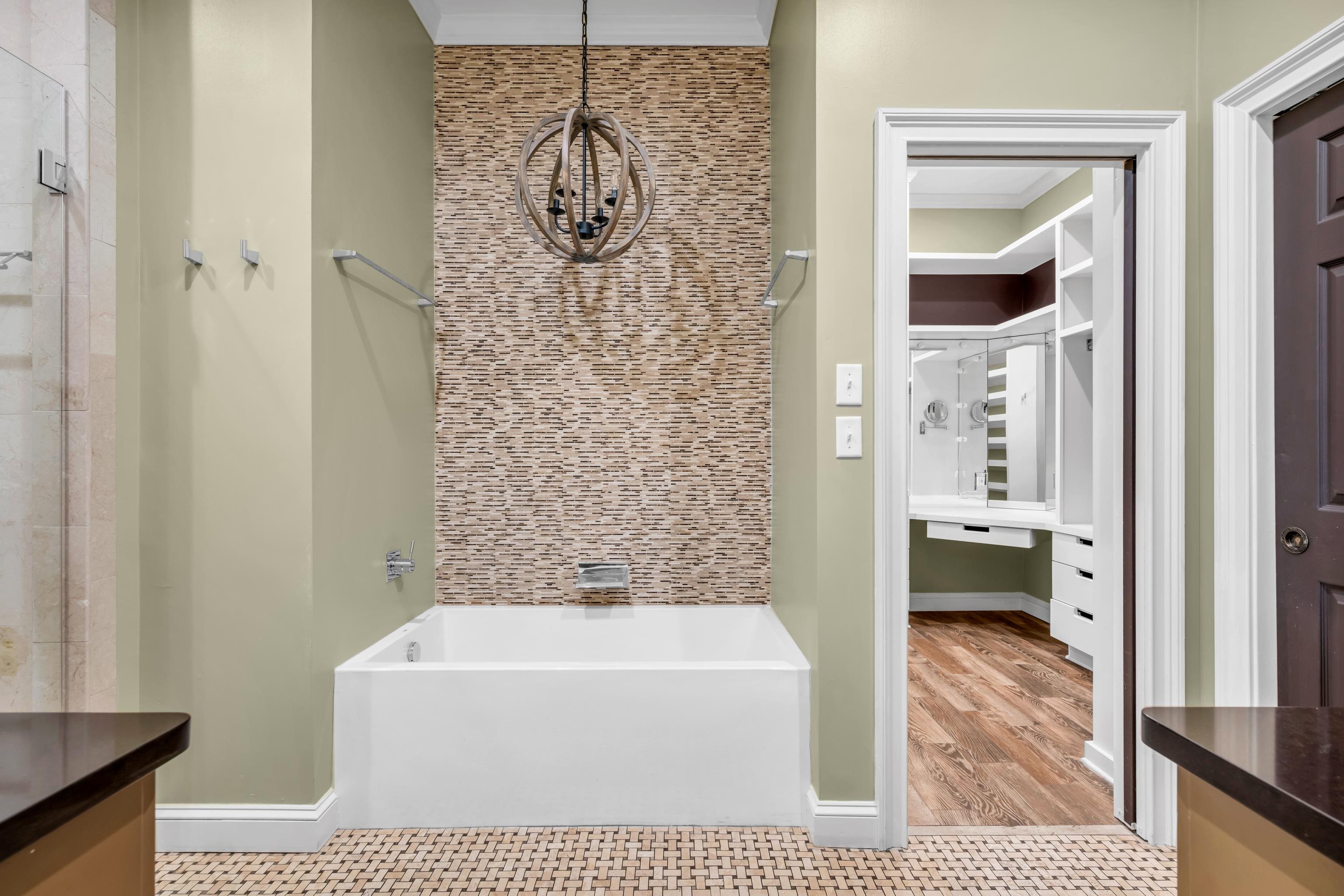 99 Red Acres Place Memphis, TN 38111 - Photo 17 of 39 a bathroom with a bathtub a shower and a sink