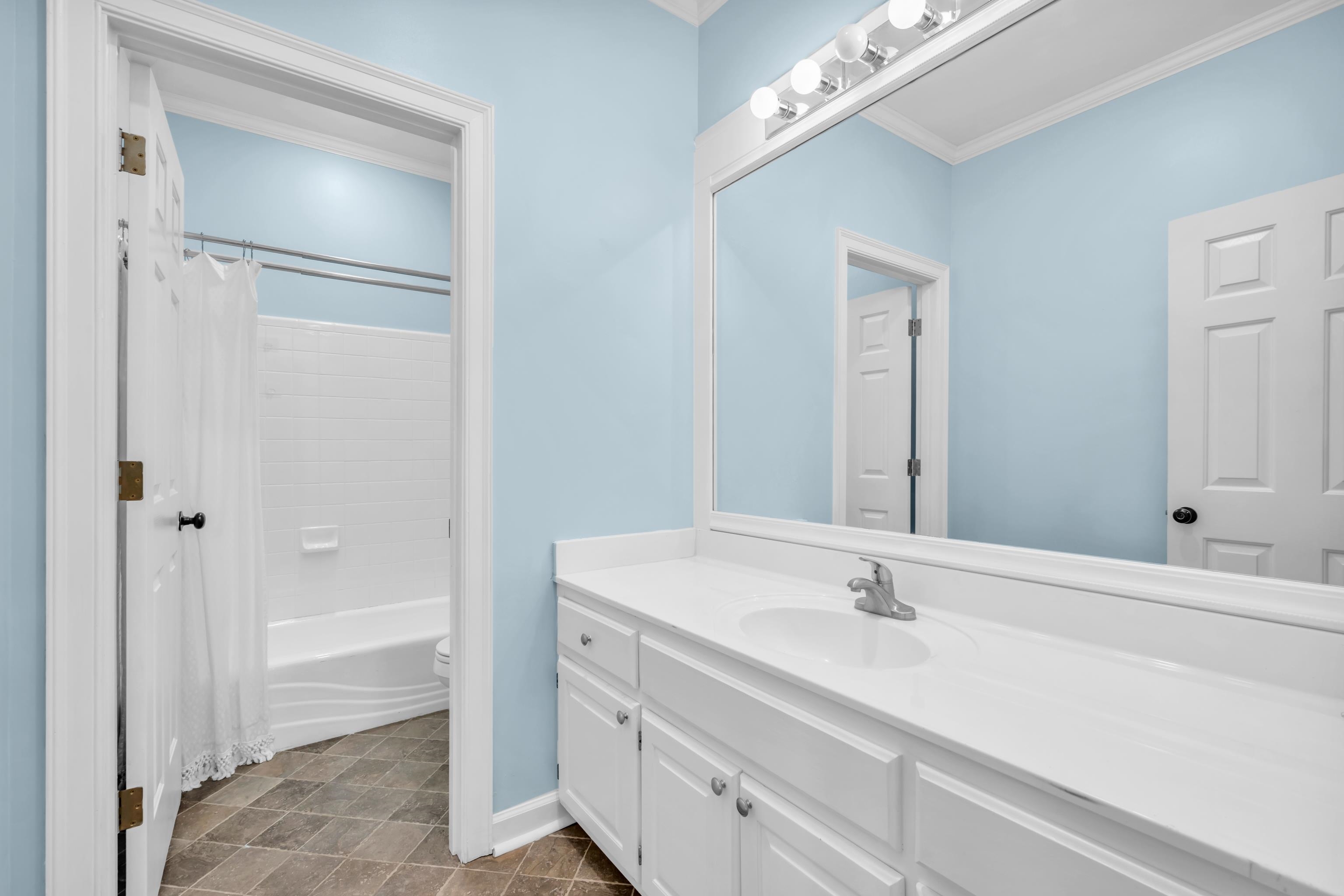 99 Red Acres Place Memphis, TN 38111 - Photo 29 of 39 a bathroom with a sink and a mirror
