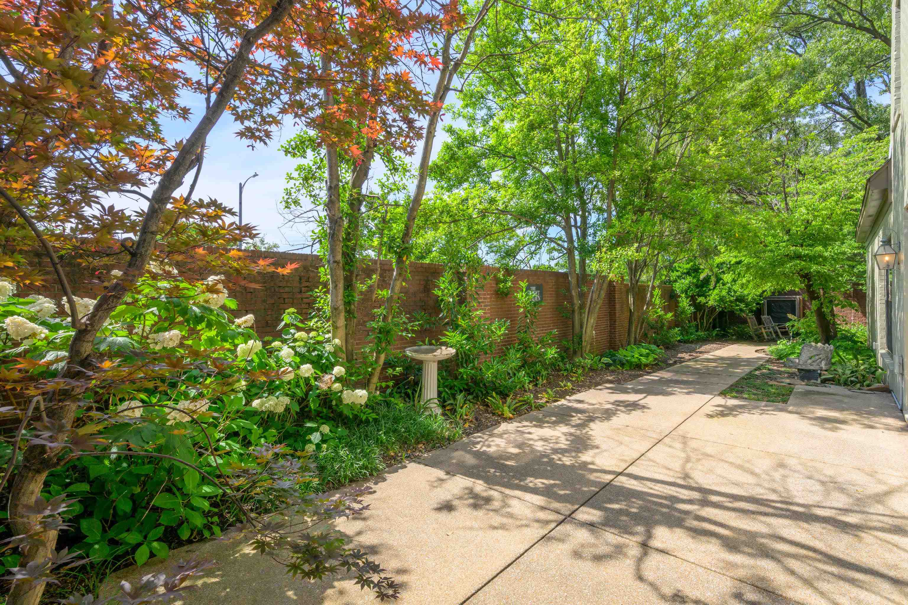 99 Red Acres Place Memphis, TN 38111 - Photo 36 of 39 a backyard of a house with lots of green space