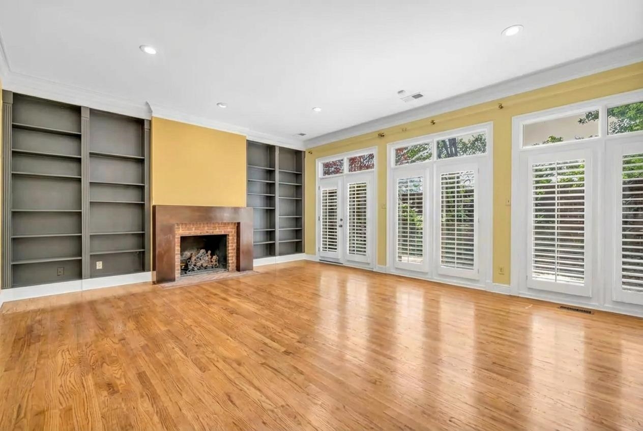 99 Red Acres Place Memphis, TN 38111 - Photo 4 of 39 a view of an empty room with a fireplace and a window