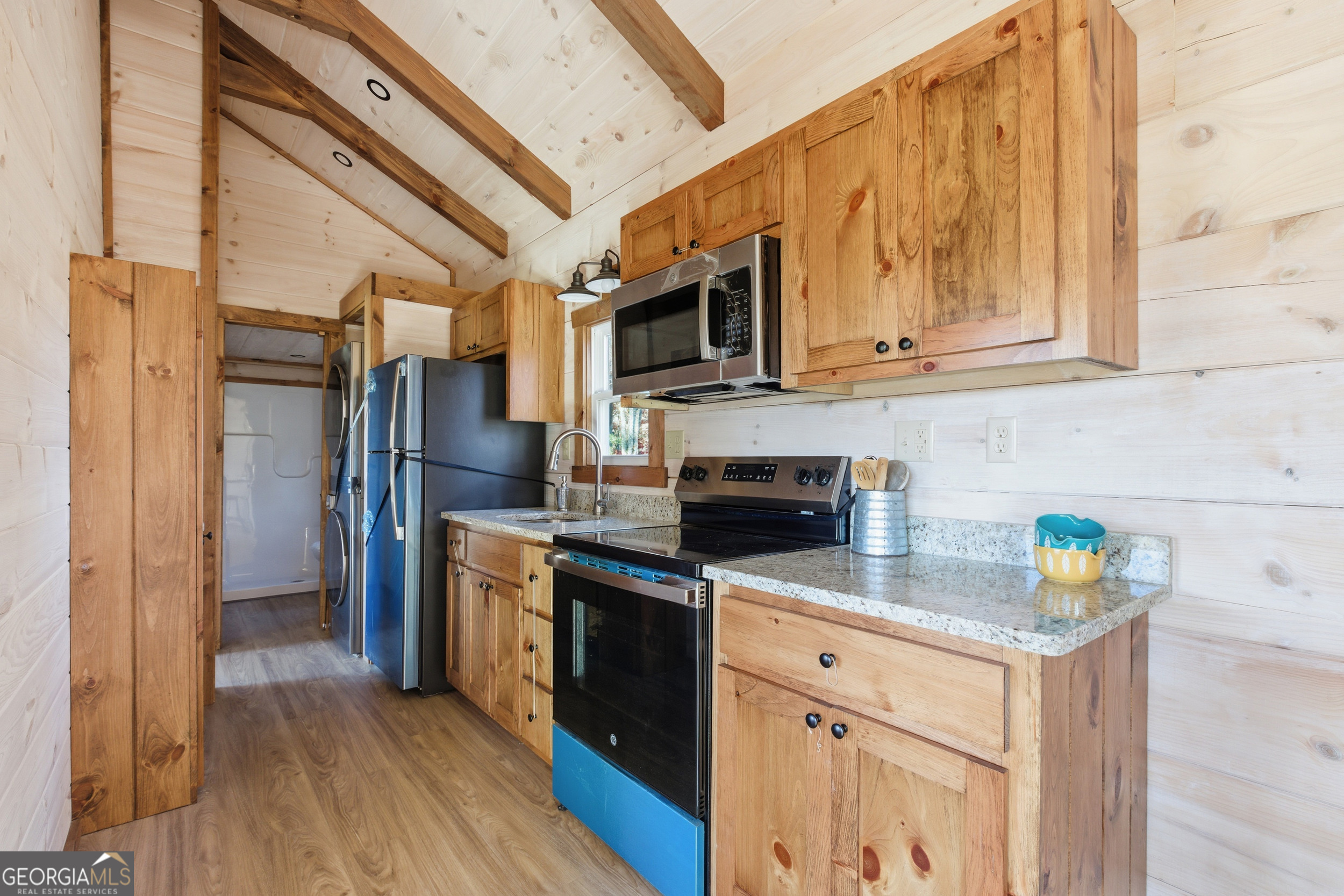 527 Saunders Road Franklin, NC 28734 - Photo 11 of 19 a kitchen with stainless steel appliances a stove microwave and a refrigerator