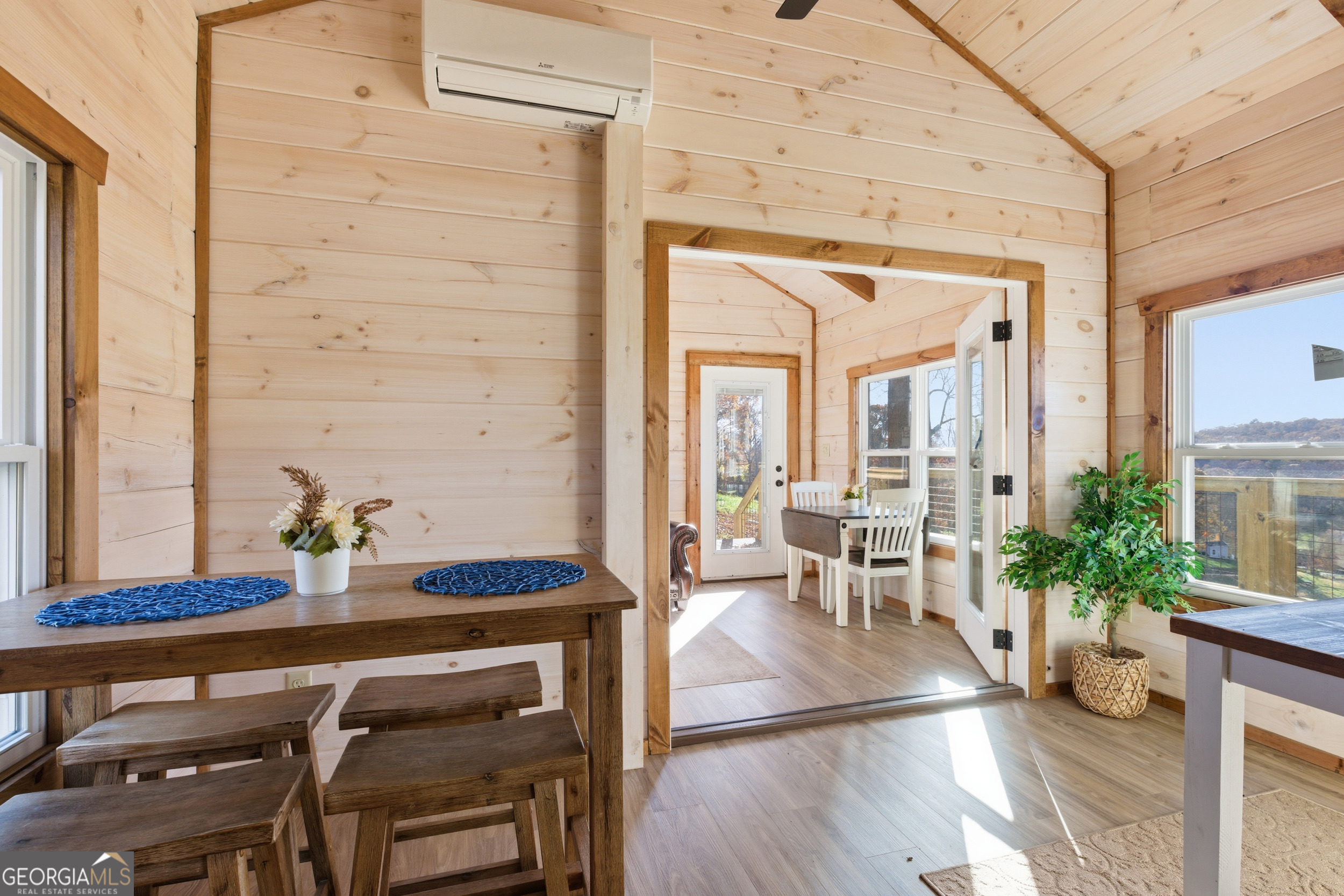 527 Saunders Road Franklin, NC 28734 - Photo 12 of 19 a view of a dining room with furniture window and wooden floor