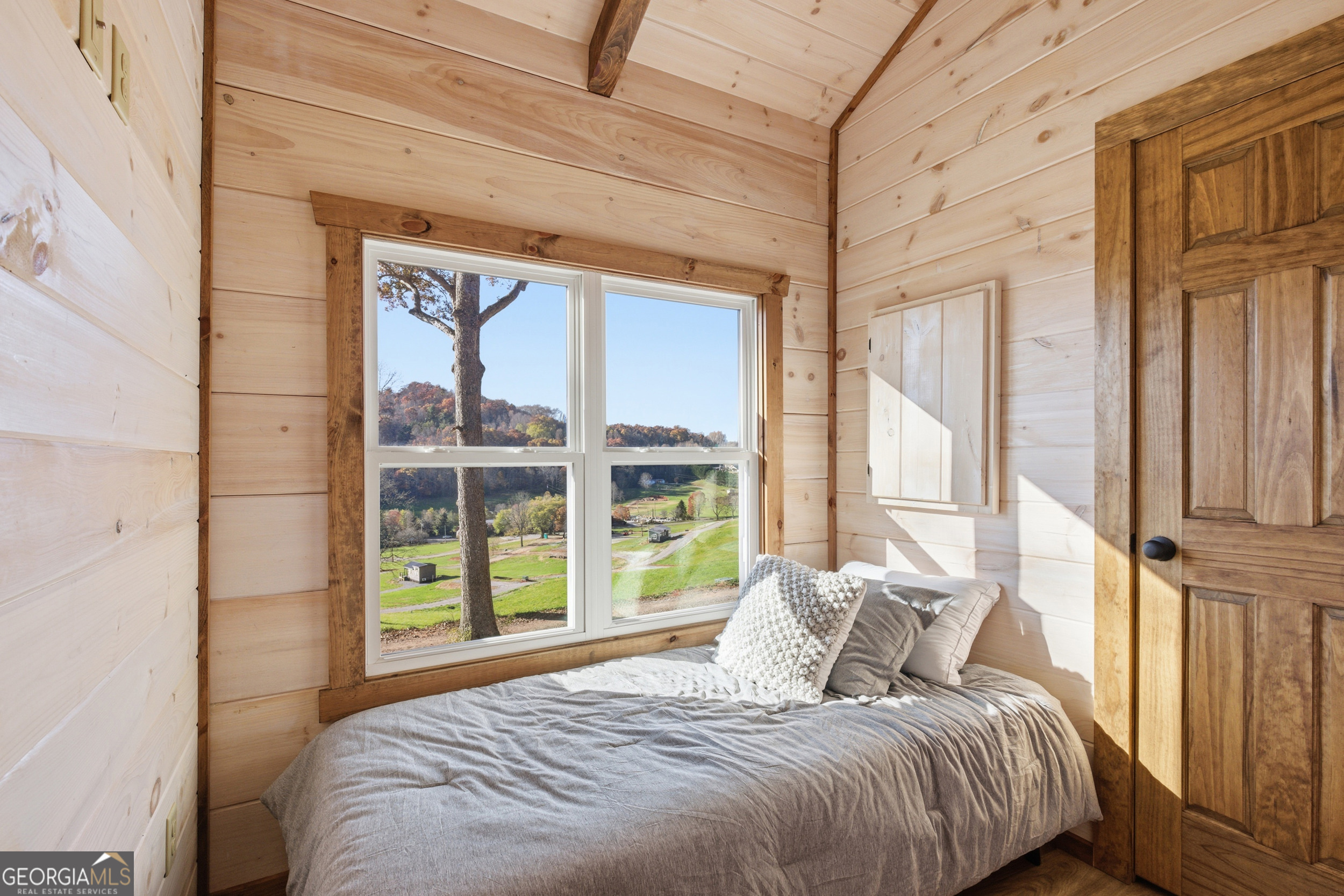 527 Saunders Road Franklin, NC 28734 - Photo 14 of 19 a bedroom with a bed and a large window