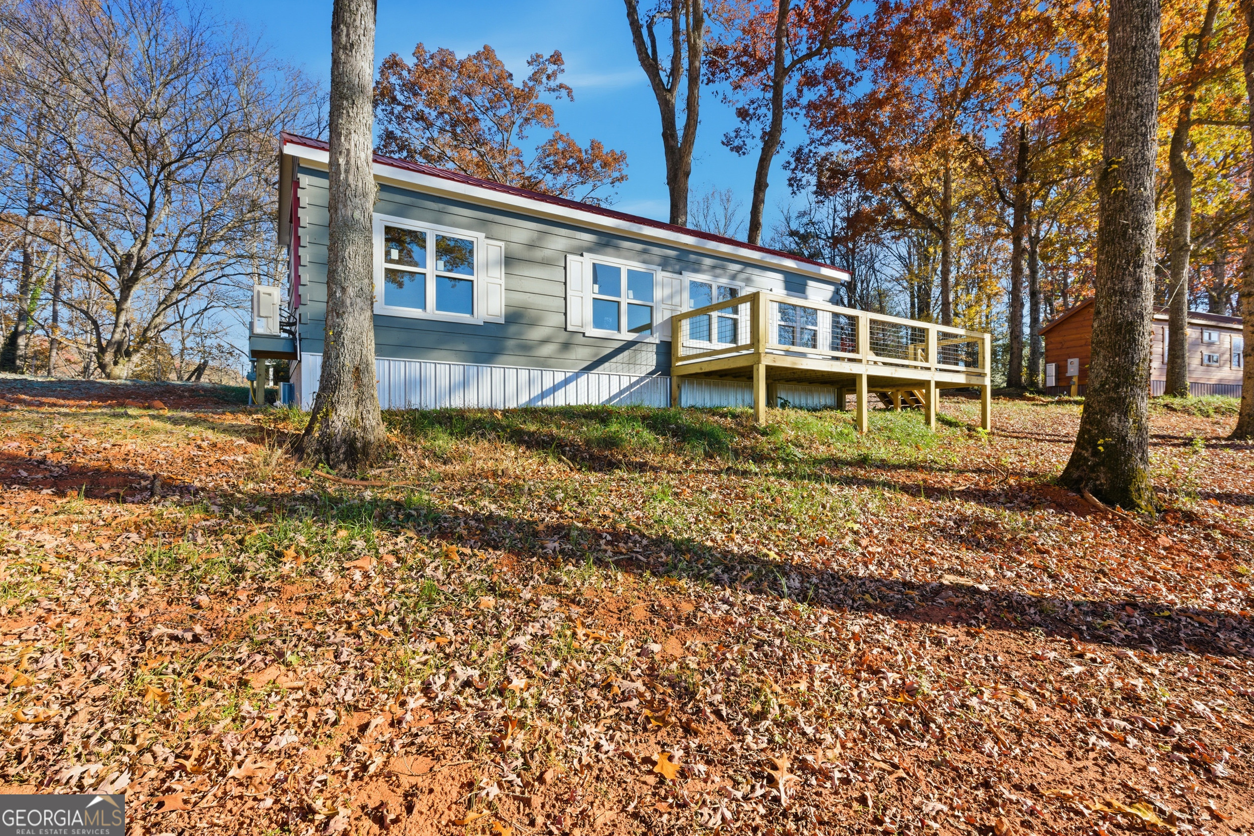 527 Saunders Road Franklin, NC 28734 - Photo 4 of 19 a view of a house with a yard