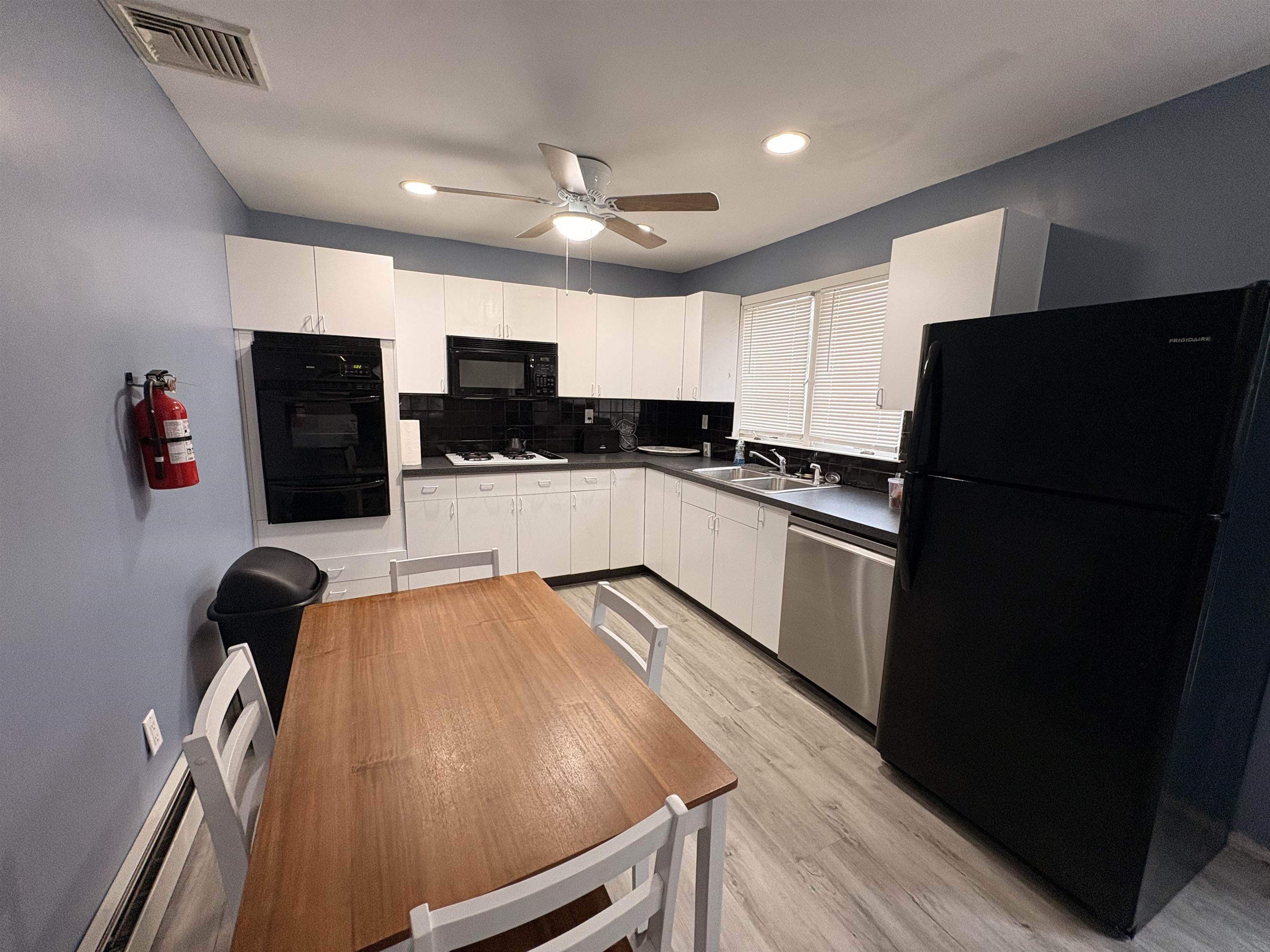 32 Franklin Street, Unit 2 Hackensack, NJ 07601 - Photo 3 of 13 a kitchen with granite countertop a refrigerator and a sink