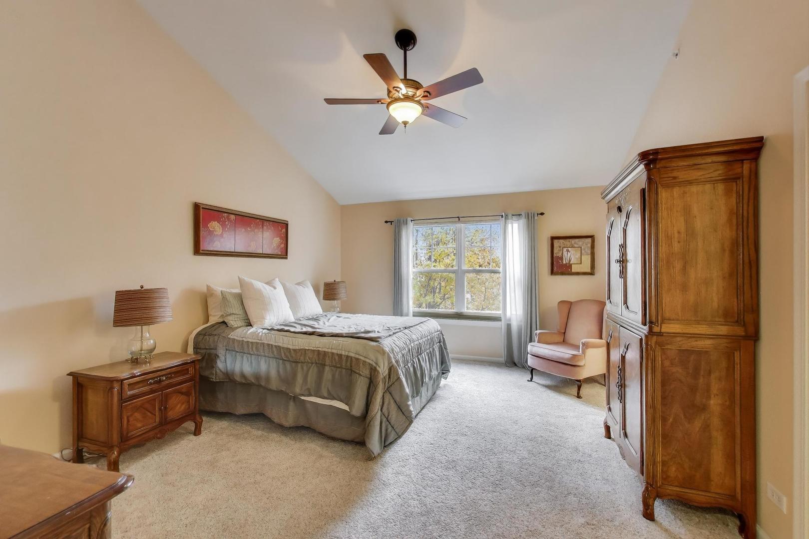 934 Tuscany Drive Streamwood, IL 60107 - Photo 19 of 45 a bedroom with a bed and a window