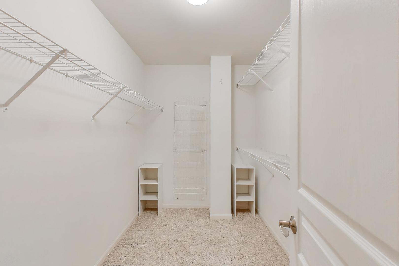 934 Tuscany Drive Streamwood, IL 60107 - Photo 24 of 45 a view of walk in closet with empty racks