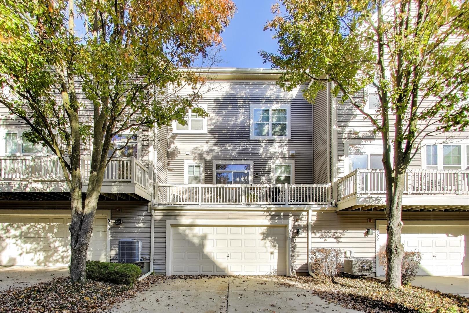 934 Tuscany Drive Streamwood, IL 60107 - Photo 36 of 45 a front view of a house with a tree