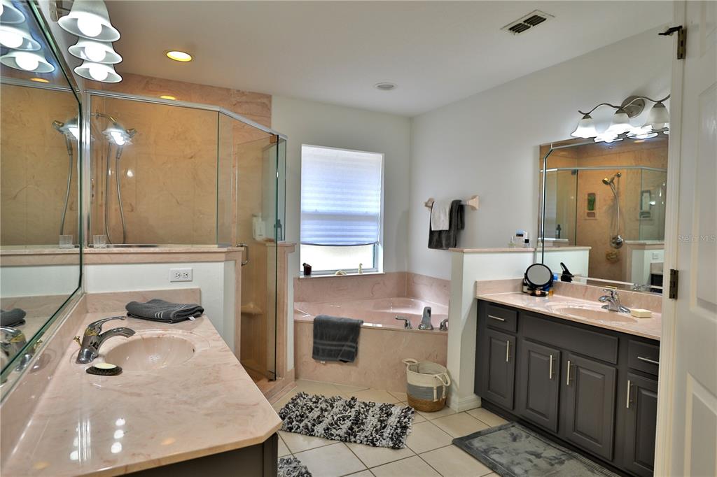 20462 Southwest 36th Street Dunnellon, FL 34431 - Photo 31 of 55 a bathroom with a sink double vanity and a mirror