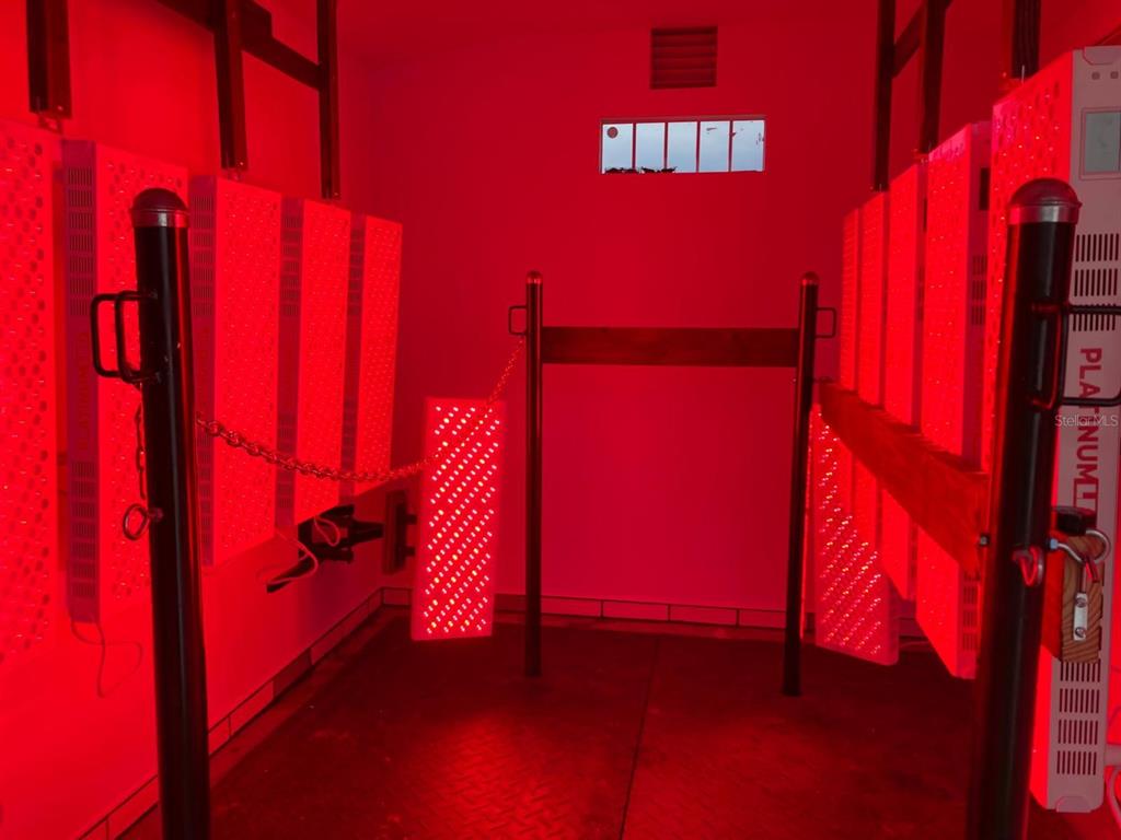 20462 Southwest 36th Street Dunnellon, FL 34431 - Photo 6 of 55 a view of a room with red door and wooden floor