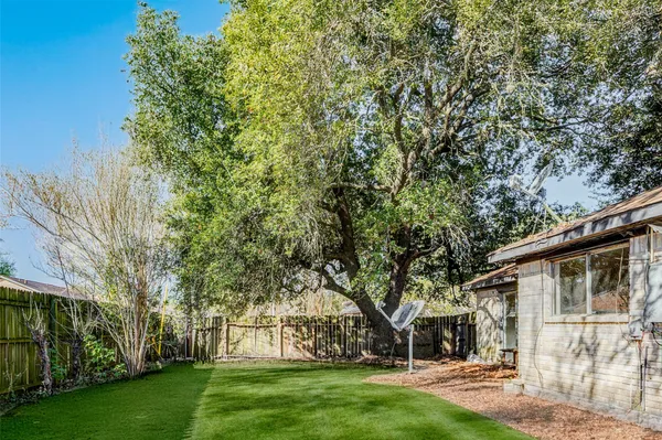 aerial view of a house with a yard