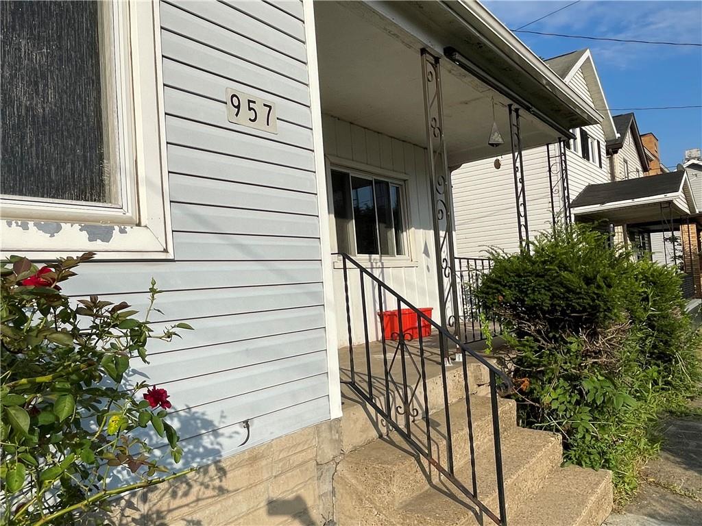 957 4th Avenue Freedom, PA 15042 - Photo 2 of 20 a view of a porch with potted plants