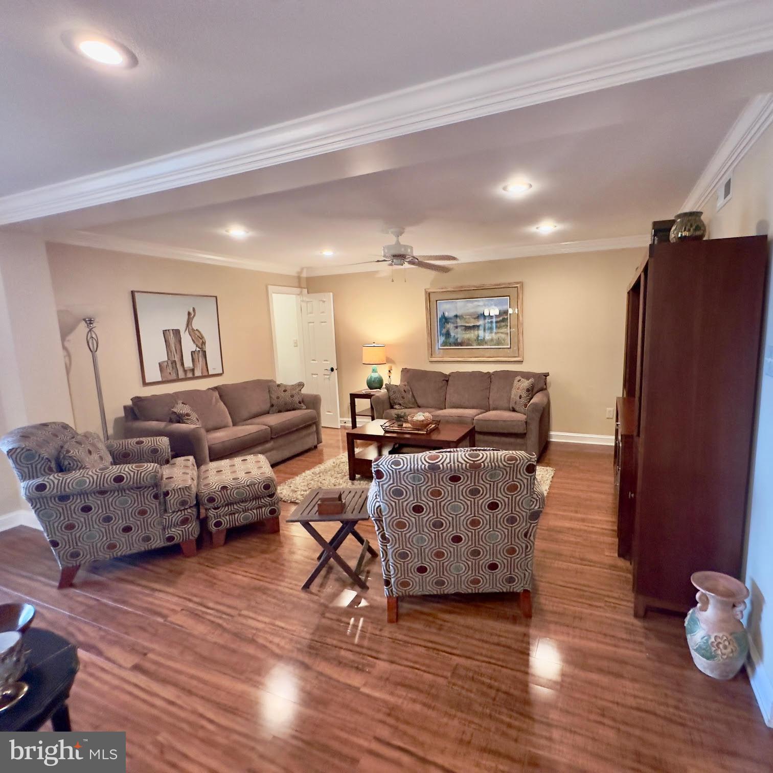 119 Old Landing Road, Unit E203 Ocean City, MD 21842 - Photo 17 of 45 a living room with furniture and wooden floor